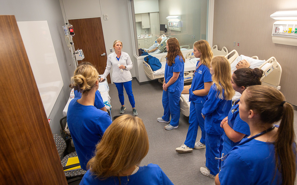 Nursing students in a simulation room.