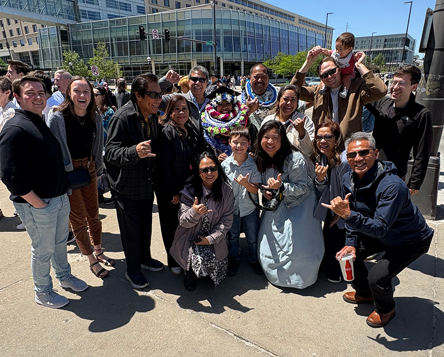 Miranda Burigsay with family and friends at commencement
