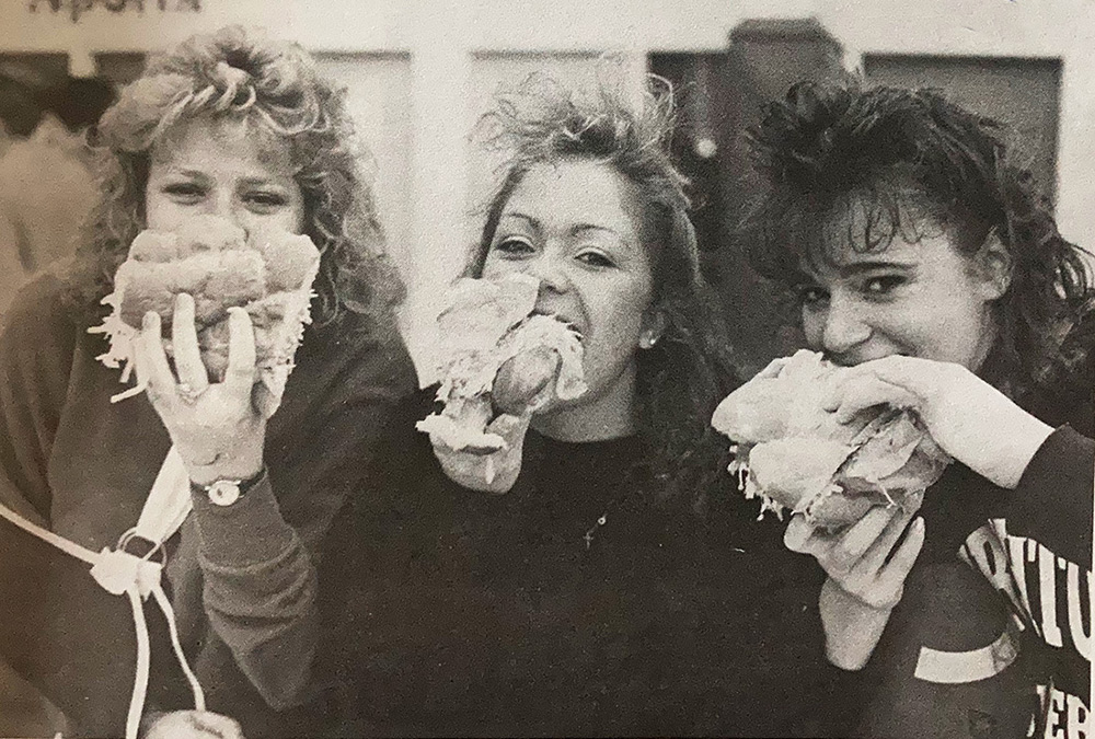 Students eat part of an 1,100-foot-long sandwich in the KFC gym in 1988.