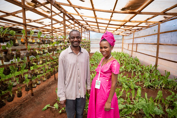 Elvis and Edith in their Dzaleka greenhouse.