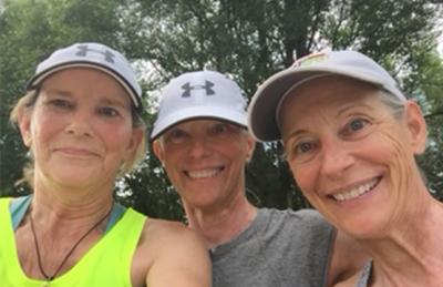 Three women smiling