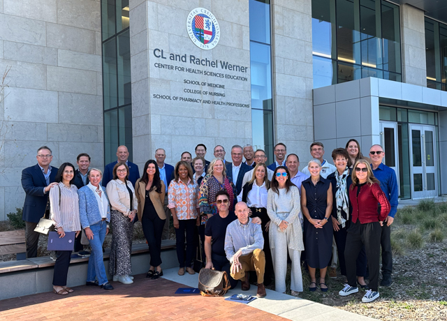 Council of Regents meet in front of the Werner Center