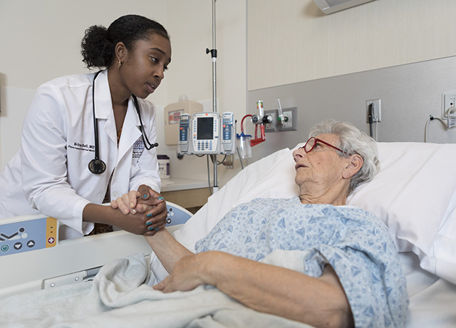 Britney Bell talks with a patient