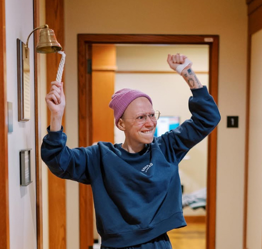 Emily rings the bell after completing her final chemotherapy treatment in late 2023.