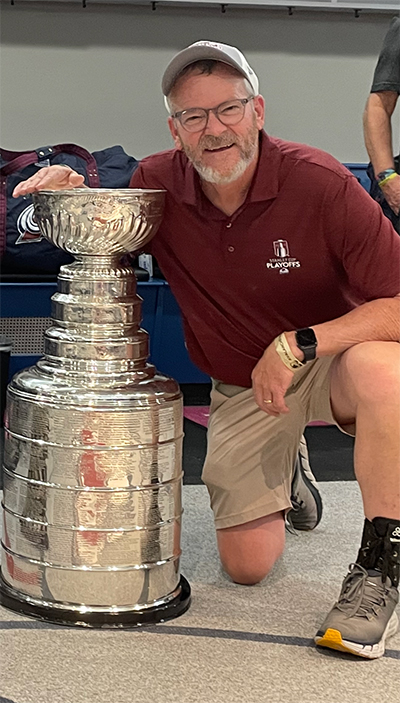 Dan Selner posing with the Stanley Cup