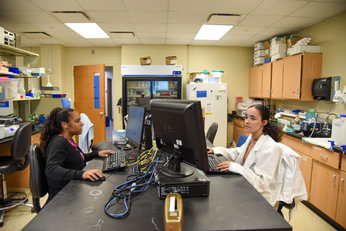 Kalia and Trinity at work in the lab.