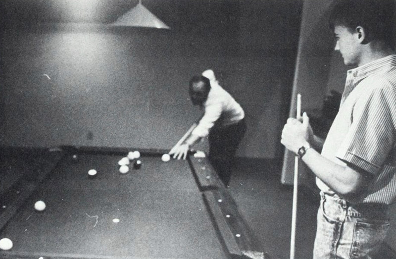 Students play pool in the Student Center.