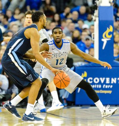 Jahenns Manigat defends a Villanova player during a 2014 basketball game