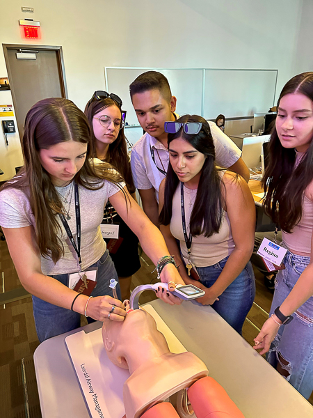 High school students take part in an intubation simulation during the Summer Health Institute. Image courtesy of Arizona State University's College of Health Solutions.