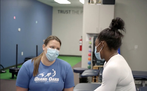 Beth Riemersma working with Olympic gymnast Simone Biles.