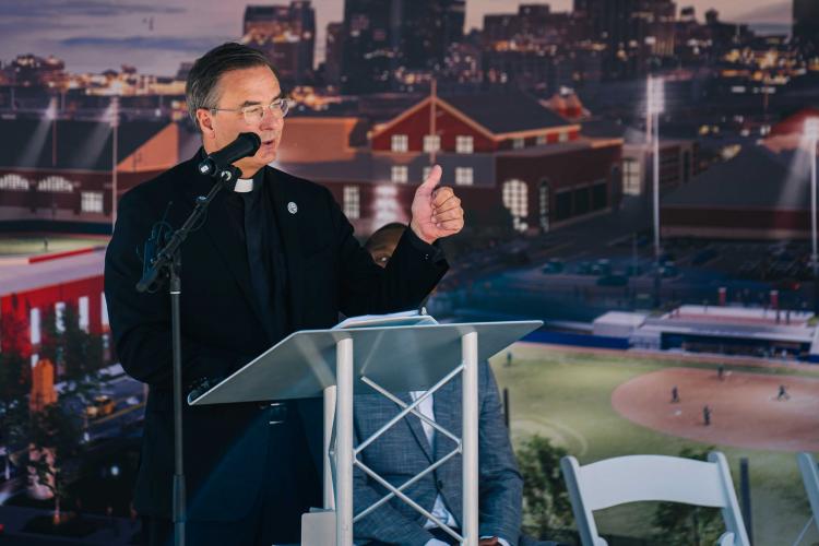 Baseball Softball Groundbreaking DSH Creighton's president speaks behind a lectern