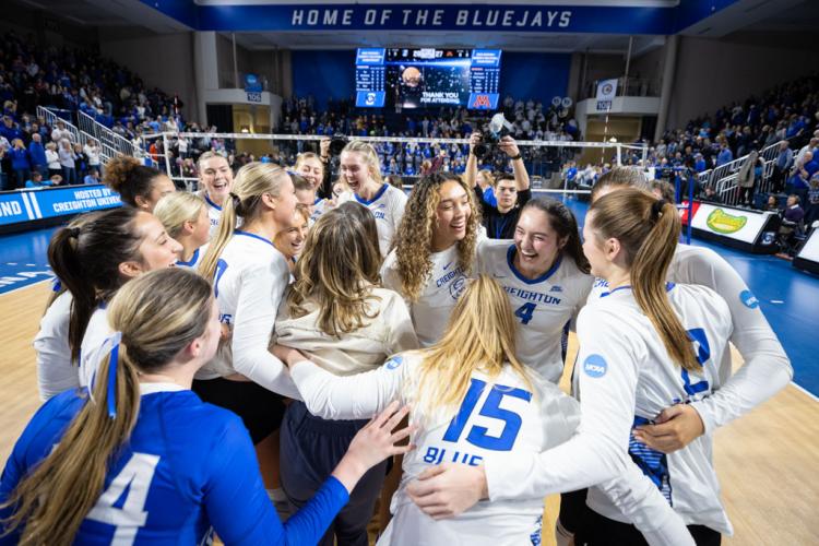 The volleyball team celebrates an NCAA tournament win