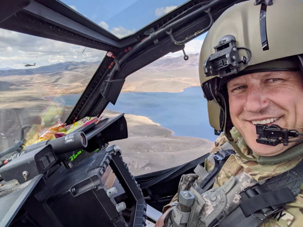 Matthew Badell flying a helicopter