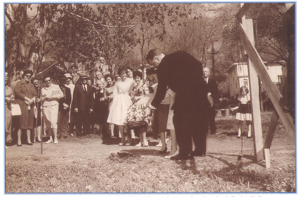 Creighton President Carl M. Reinert shovels dirt at the Gallagher Hall groundbreaking in 1960.