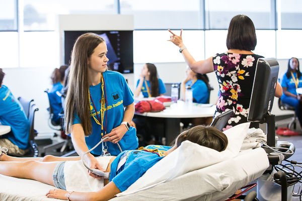 Julia Jackman practices taking an ultrasound at the 2016 Summer Health Institute camp.