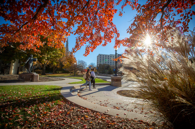 Students walk campus during the fall.