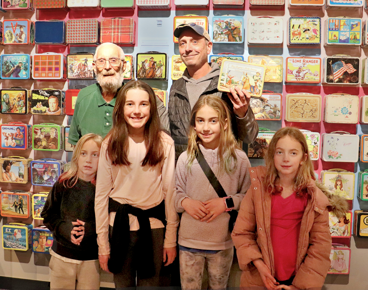 Mark, center, with his four daughters and his father, Michael.