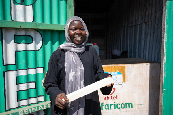 Sadia, owner of the Kakuma soapmaking business Shanab Detergent, holds a block of soap.
