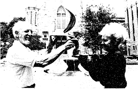In 1989, sculptor Grant Kenner and donor Anna Lou Micek envision what the Eternal Flame will look like.