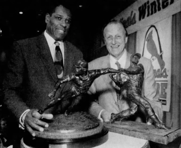Cardinals greats Gibson and Stan Musial stand with the cast models of their statues in 1998.