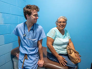 A medical student cares for a patient