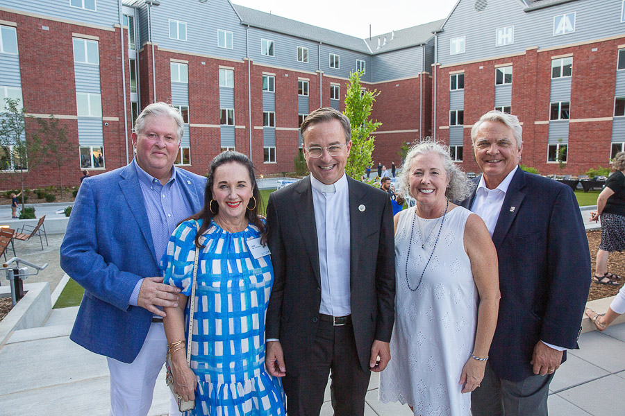 Fr. Hendrickson with the Graves and Simpson families.