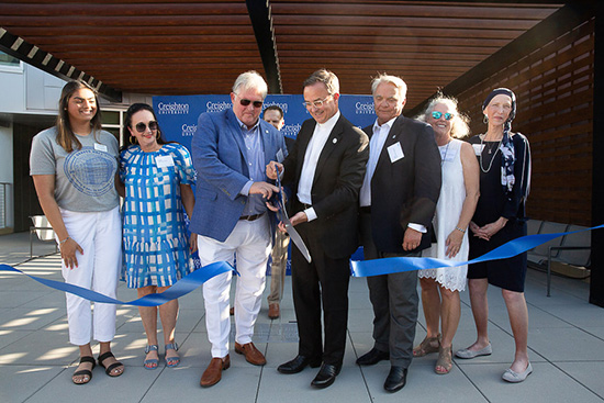 DSH, the Simpson and the Graves families cut the Graves Hall dedication ribbon.