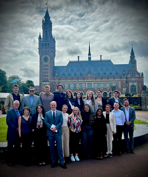 An N2H delegation of students and faculty in front of the International Court of Justice in The Hague.