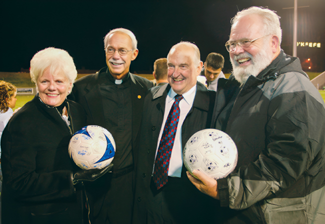 Suzanne Scott, left, and former Kiewit CEO Walter Scott, Jr., with former Creighton presidents John P. Schlegel, SJ, and Michael G. Morrison, SJ, at Morrison Stadium in 2004. Suzanne Scott, left, and former Kiewit CEO Walter Scott, Jr., with former Creighton presidents John P. Schlegel, SJ, and Michael G. Morrison, SJ, at Morrison Stadium in 2004.