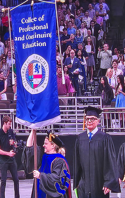 Al Lopez walking into Creighton commencement