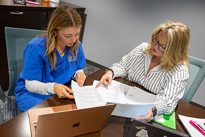 Olivia Manning and Tamara Oliver doing research