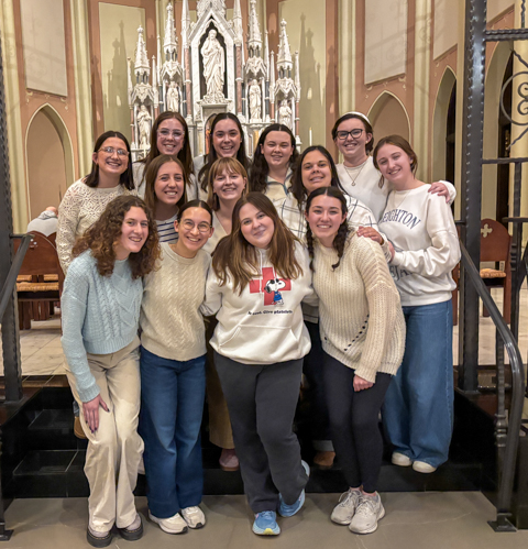 Kathryn, bottom right, with the Tuesday night Mass choir.