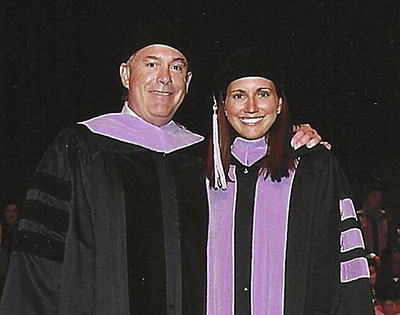 John Meyer, DDS'81, with daughter at hooding ceremony