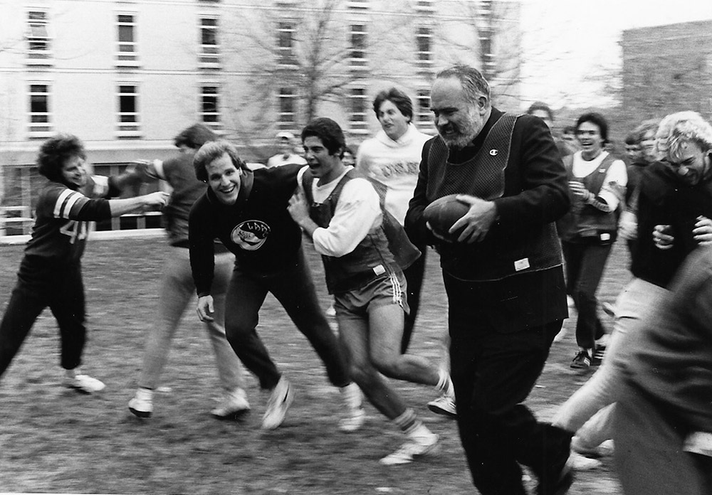 Fr. Morrison runs a touchdown in a 1983 football game.