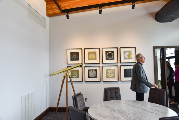 Fr. Clifton looks around the Gerard Manley Hopkins Community Room of the Jesuit Residence.