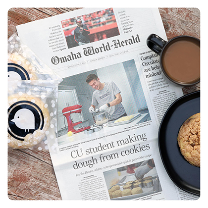 Image of Omaha World Herald with Student making cookies Image of Omaha World Herald with Student making cookies