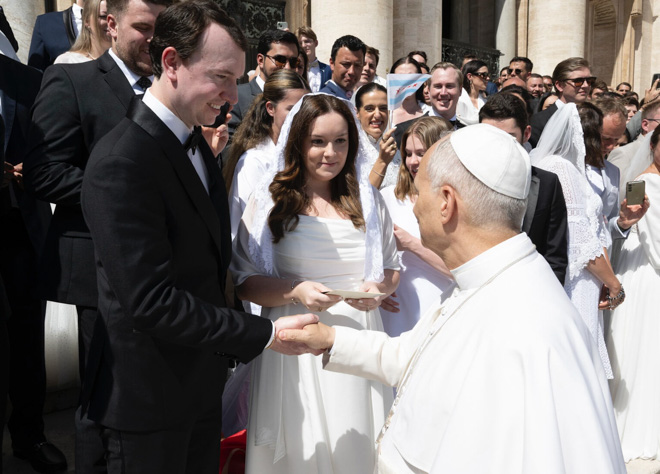 Andrew and Megan Ronnfeldt receive a marriage blessing from Pope Leo at the Vatican.