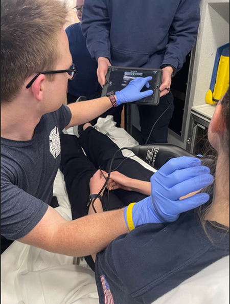 Chis Pritza demonstrates the POCUS device