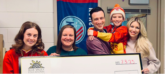 Michael, Brody and Brandy Rea present a $100,000 to support the LIFT program, which provides services to children with autism in Brody's school district.