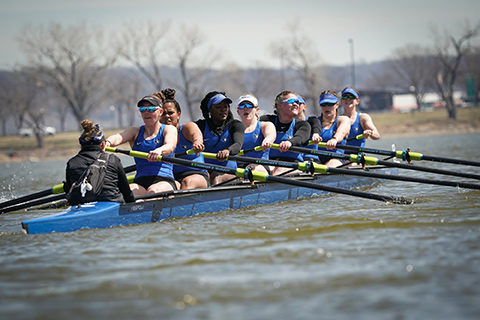 Rowing team on the water rowing