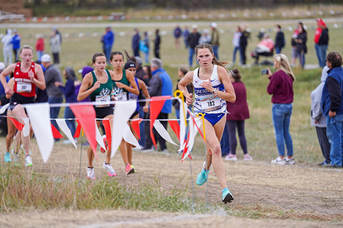 Creighton runner running at meet.