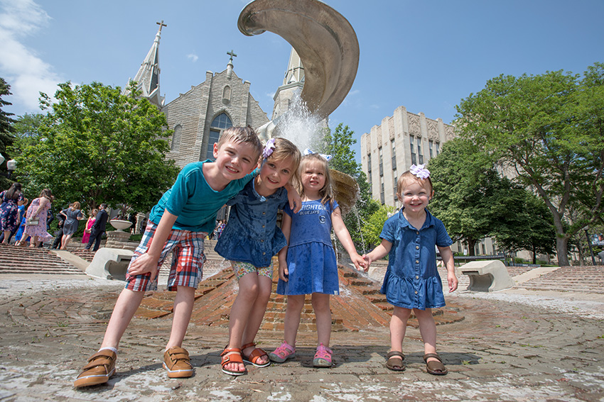 Children standing near St. John's fountain