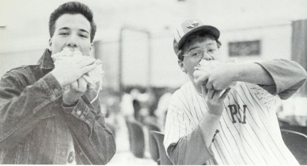 Students eat part of an 1,100-foot-long sandwich in the KFC gym in 1988.
