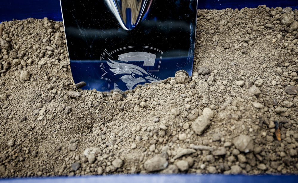 Shoveling dirt at the SPC event.