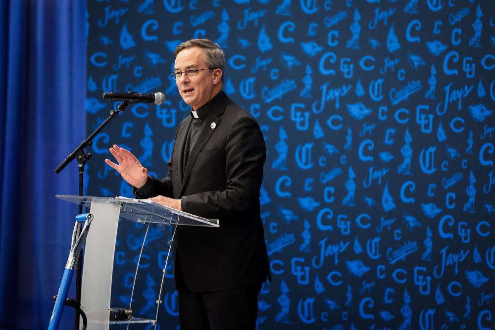 Fr. Hendrickson speaks at the Sports Performance Center groundbreaking event.