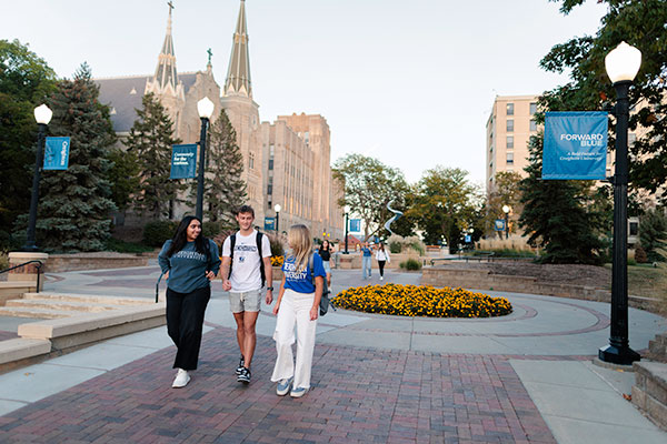 Students walking across campus Students walking across campus