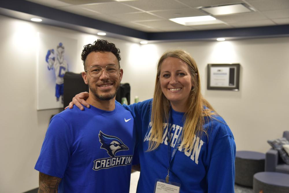 A man and a woman pose together for a photo