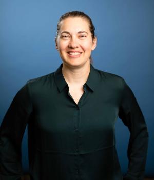 A professor smiles for a photo