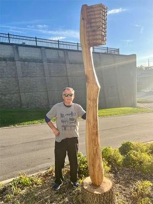 John Meyer, DDS'81, with toothbrush carving