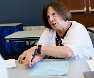 Creighton associate professor Carol Zuegner speaks with a student.